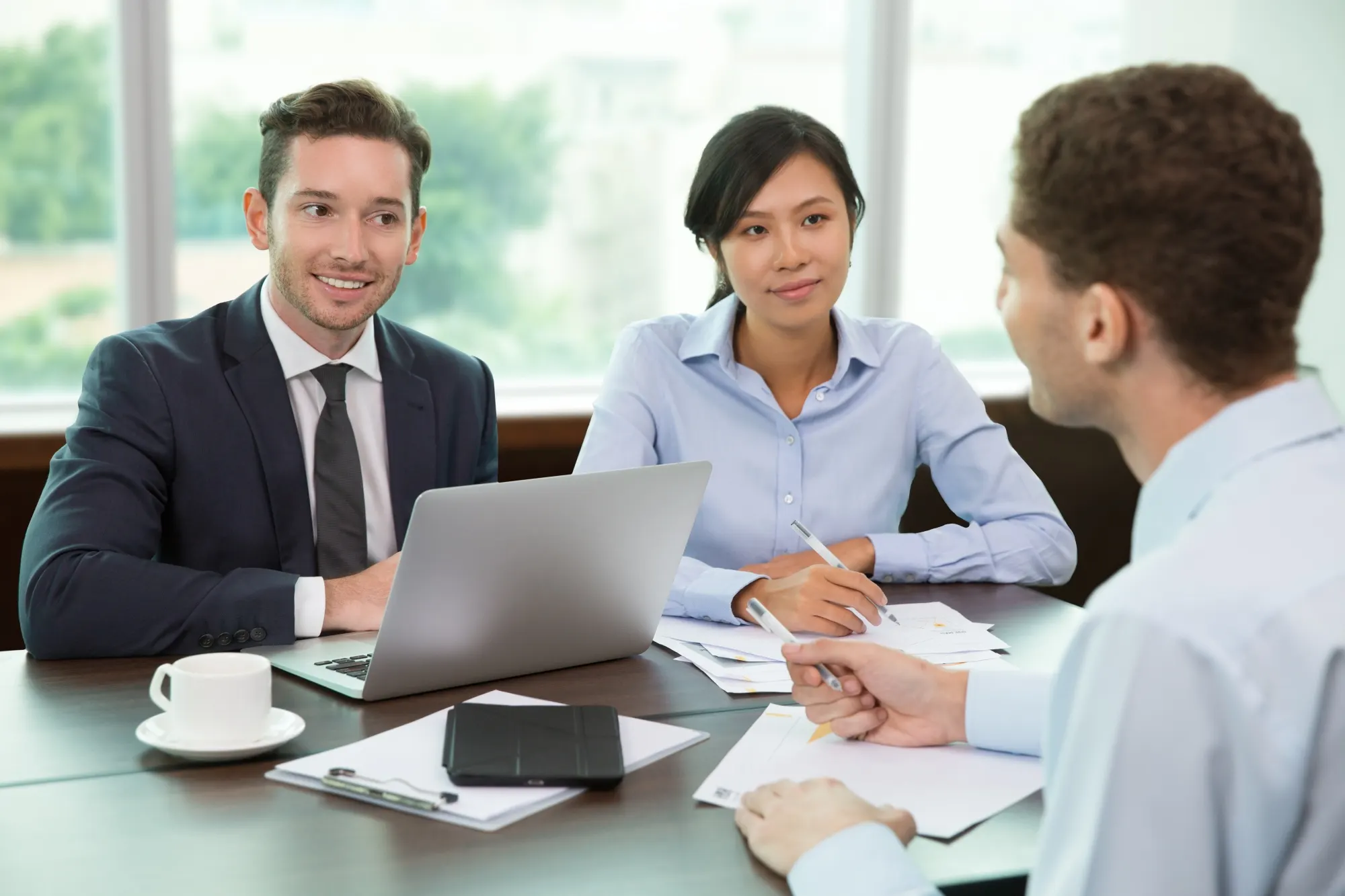 insurance agent with client in office